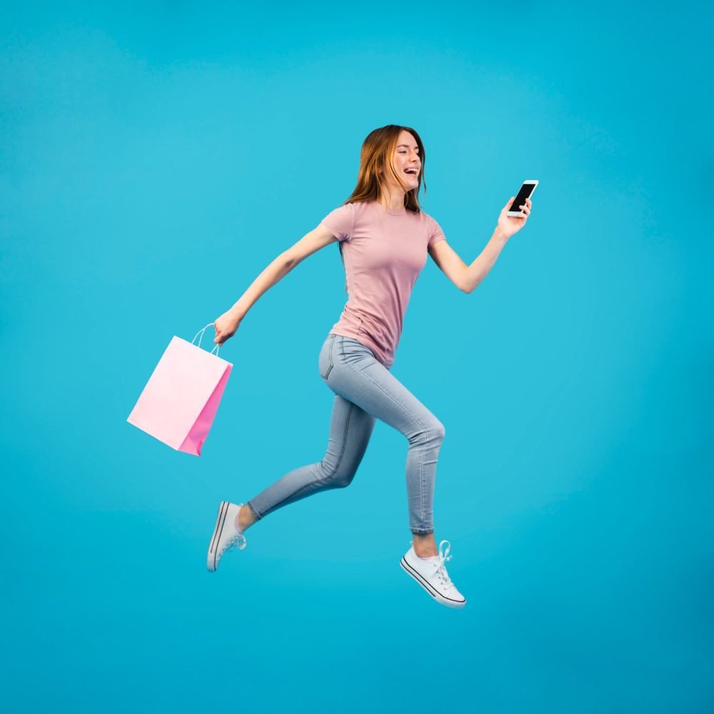 full-shot-woman-running-with-phone-min